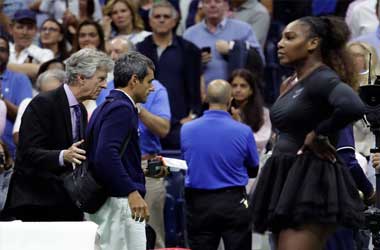 Umpire Carlos Ramos being escorted off court after conflict with Serena Williams