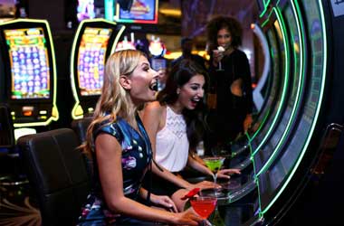Slot Machine players enjoying a drink whilst playing