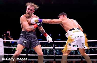 Tommy Fury strikes Jake Paul during boxing fight