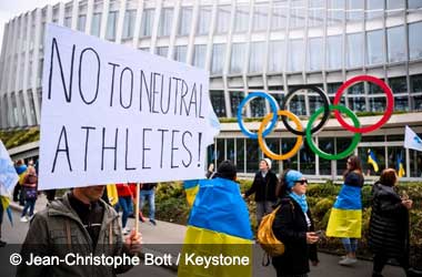 Ukrainians rally outside IOC headquarters against Russian and Belarusian athletes participating under a neutral flag 
