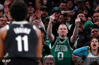 Kyrie Irving playing for the Brooklyn Nets being abused by Celtic Boston fans