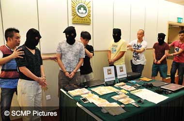 Macau Police arresting suspects of illegal gambling