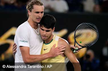 Carlos Alcaraz embraces Alexander Zverev at the Australian Open 2024 after loss
