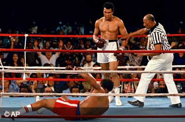 Muhammad Ali knockouts George Foreman in 'The Rumble In The Jungle'